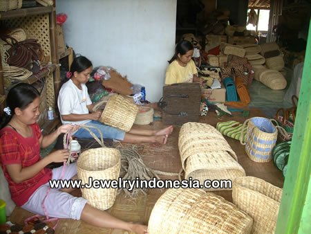 Village women weaving water hyacinth for bags